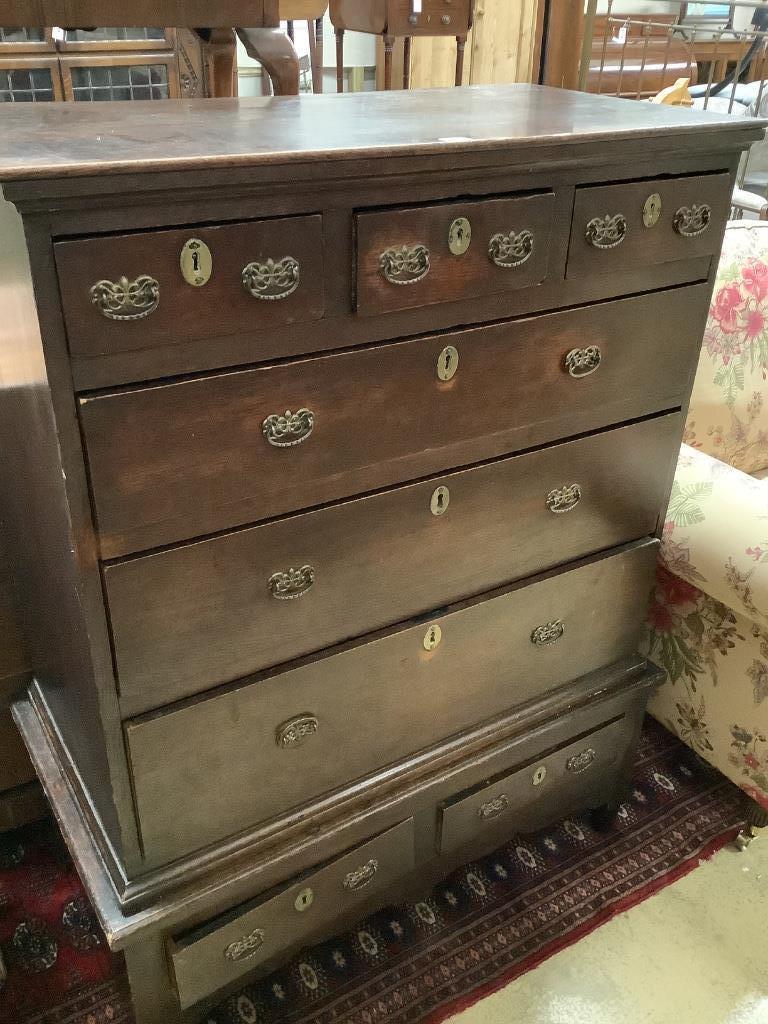 An 18th century oak chest on stand, width 100cm depth 50cm height 129cm